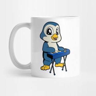 Cartoon penguin playing keyboard Mug